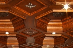 Octagonal coffered wood ceiling with carved rosettes and recessed lights