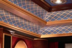 Wood-framed ceiling trays with blue lattice-painted panels and gilded trim