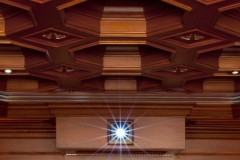 Octagonal coffered wood ceiling above the projector port in the rear wall